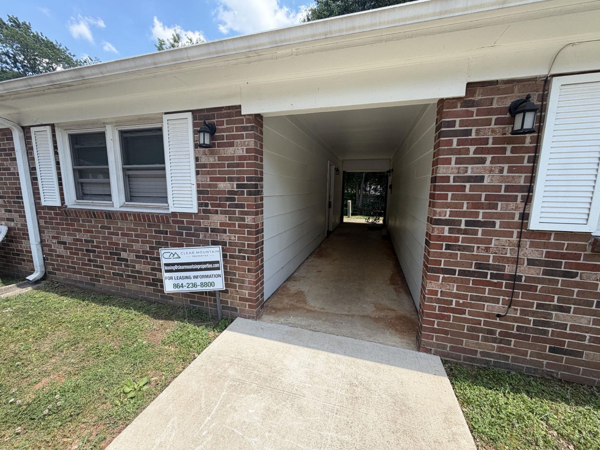 Covered brick breezeway between apartment buildings at Creekside Apartments
